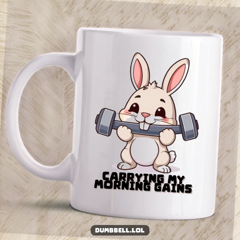 Funny mug showing a pouncing rabbit with a dumbbell in its mouth, displaying pride and humorous fitness determination.